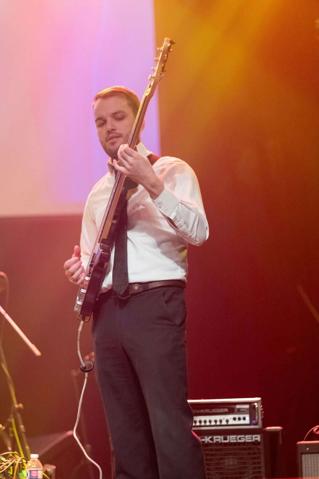 Austin Haw playing bass on stage